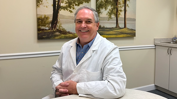 Orthodontist P. Todd Bonner In Lab Coat Smiling